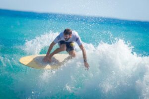 Surfing is a dance between surfer and wave, an exhilarating fusion of skill, timing, and intuition. Whether you're a seasoned pro or a novice eager to catch your first wave, choosing the right surfing spot is essential for a memorable and enjoyable experience. While factors such as water temperature, crowd levels, and local amenities play a role in selecting a surf spot, perhaps the most critical consideration is wave size and shape. In this blog post, we'll delve into the importance of wave size and shape when choosing a surfing spot and provide valuable insights to help you find the perfect wave for your skill level and preferences. Understanding Wave Size: Wave size refers to the height and power of waves breaking at a particular surf spot and plays a significant role in determining the suitability of the spot for different skill levels and surfing styles. Here's what you need to know about wave size: Height: Wave height is measured from the trough (lowest point) to the crest (highest point) of a wave and is typically categorized as small, medium, or large based on the size of the waves breaking at the surf spot. Beginners may prefer smaller waves (1-3 feet) for learning and practicing basic skills, while experienced surfers may seek out larger waves (4-10+ feet) for more challenging and exhilarating rides. Power: Wave power refers to the force and energy exerted by waves as they break, which can vary depending on factors such as swell direction, wind conditions, and underwater topography. More powerful waves are generally better suited for experienced surfers who have the skill and confidence to navigate the wave's intensity and speed. Considering Wave Shape: Wave shape refers to the overall quality, form, and consistency of waves breaking at a surf spot and can significantly impact the surfing experience. Here are a few key factors to consider when evaluating wave shape: Cleanliness: Clean, well-defined waves with smooth faces and minimal chop are ideal for surfing, as they offer better rideability and maneuverability. Look for surf spots with clean, glassy conditions, especially during early mornings or late afternoons when winds are light and offshore. Shape: The shape of waves can vary depending on factors such as swell direction, wave period, and bottom contours. Ideally, look for waves with a clean, peeling shape that allows for long, smooth rides and the opportunity to perform maneuvers such as carving and trimming. Consistency: Consistency refers to the regularity and frequency of waves breaking at a surf spot, which can vary depending on factors such as tide, swell direction, and local geography. Choose surf spots known for their consistent waves, as this ensures a steady supply of rideable waves throughout your session. Choosing the Right Spot for Your Skill Level: When selecting a surf spot based on wave size and shape, it's essential to consider your skill level, experience, and comfort level in the water. Here are a few guidelines to help you choose the right spot for your abilities: Beginners: Novice surfers should start with smaller, gentler waves that provide a forgiving learning environment and ample opportunities to practice basic skills such as paddling, popping up, and riding straight. Look for surf spots with mellow, rolling waves and sandy bottoms, as these are typically more beginner-friendly. Intermediate Surfers: Intermediate surfers who have mastered the basics and are ready to progress to more challenging waves can seek out surf spots with medium-sized waves and clean, well-shaped faces. These spots offer opportunities to practice turning, trimming, and riding down the line while still providing a manageable level of difficulty. Advanced Surfers: Experienced surfers seeking an adrenaline rush and the ultimate challenge may gravitate towards surf spots with larger, more powerful waves and barreling, hollow sections. These spots require advanced skills, knowledge of wave dynamics, and confidence in navigating critical sections and fast-breaking waves. Conclusion: When it comes to choosing the perfect surfing spot, wave size and shape are key considerations that can make or break your surfing experience. By understanding the nuances of wave size and shape and selecting a spot that aligns with your skill level and preferences, you can maximize your time in the water and enjoy the thrill of riding the perfect wave. So, whether you're a beginner honing your skills or an experienced charger seeking the ultimate challenge, take the time to consider wave size and shape when selecting your next surfing destination, and get ready to embark on an unforgettable surfing adventure.